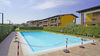 Bilocale con spazioso balcone in residence con piscina a Puegnago del Garda