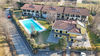 Appartamento di testa con giardino privato in residence con piscina a Manerba del Garda
