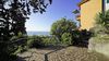 Bilocale con terrazzo panoramico e magnifica vista Lago in residence con piscina 